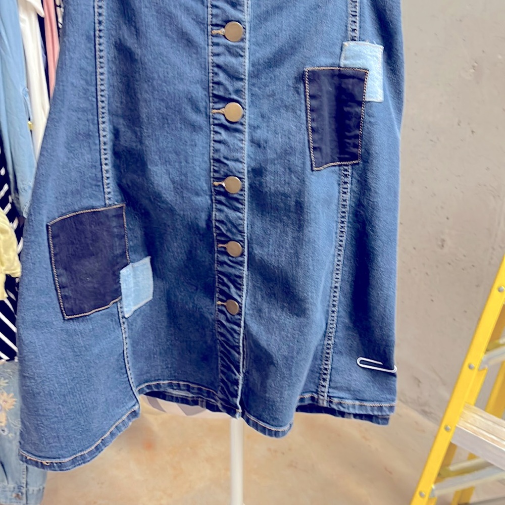 Darling denim skirt with patches. Love it but I have lost weight . Your luck.